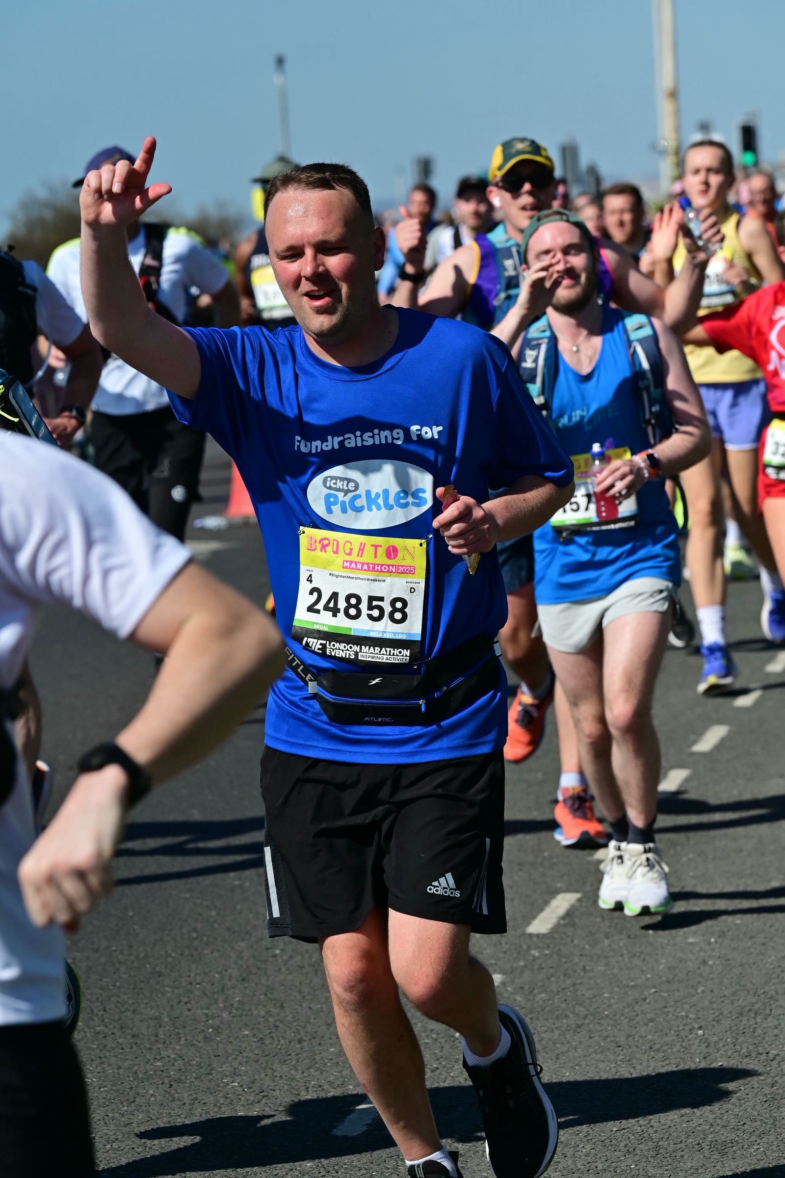 A runner wearing an Ickle Pickles t-shirt.