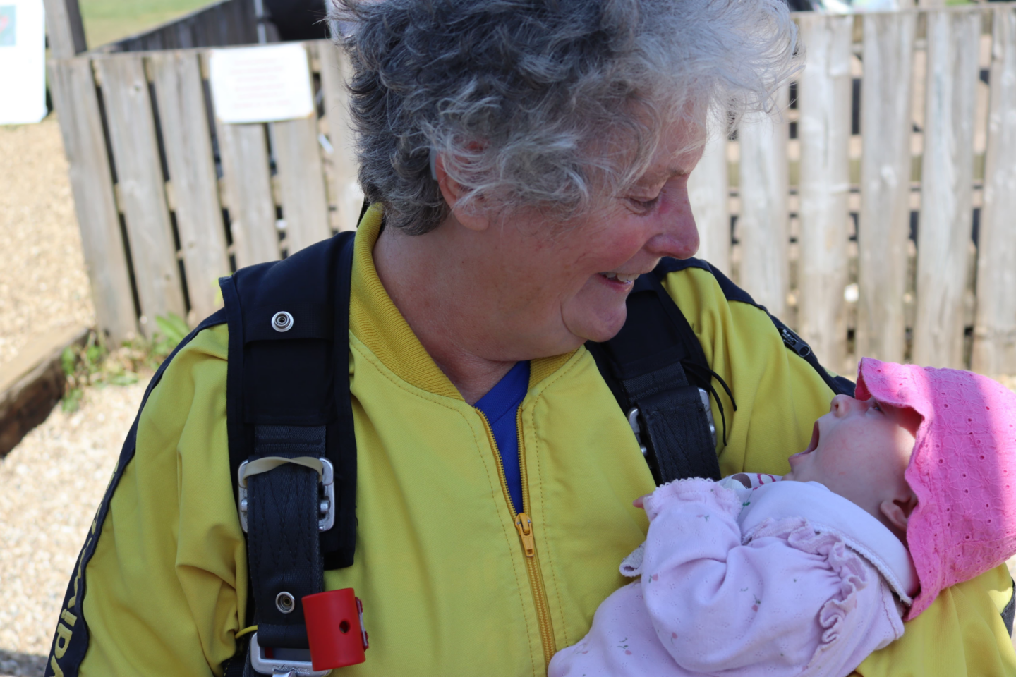 Alicia's Grandmother Theresa holding Alicia after jumping out of the plane.