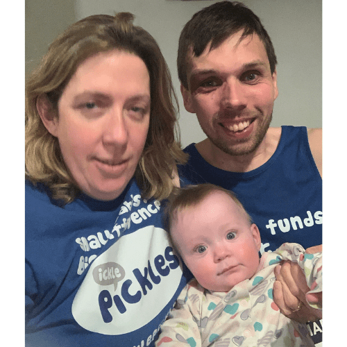 Baby Amelia with her mum and dad