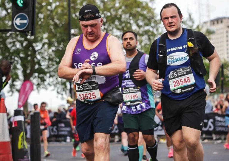 A runner in central London wearing an Ickle Pickles running top