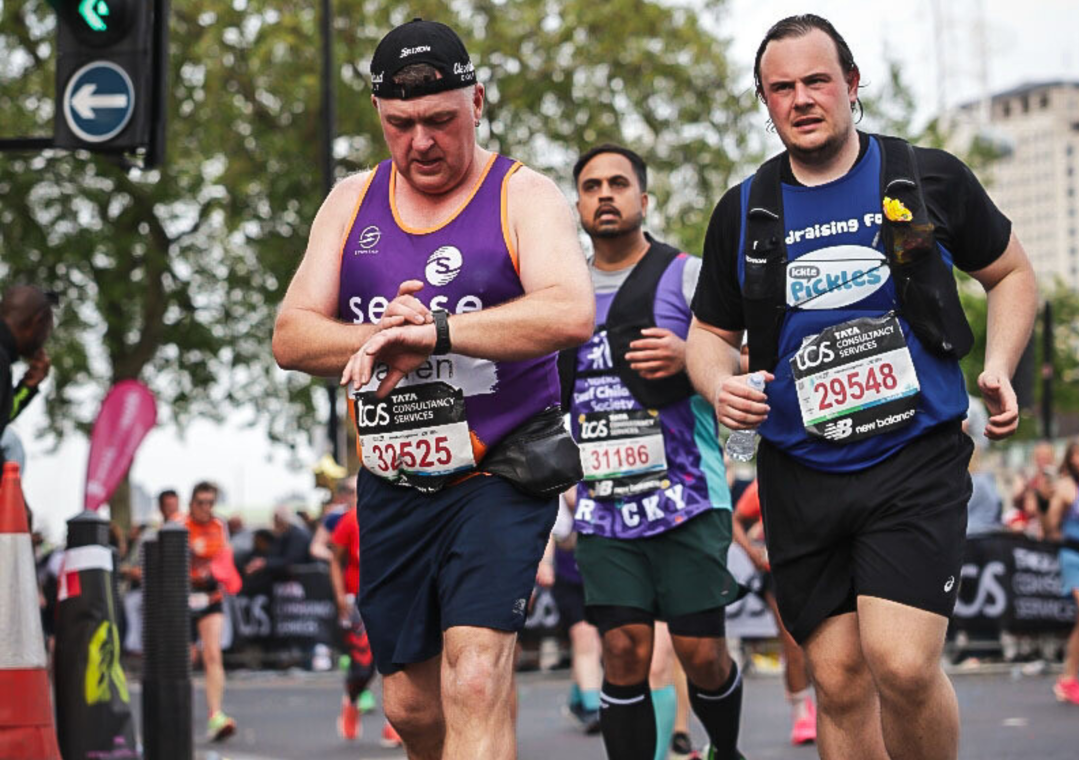 A runner in central London wearing an Ickle Pickles running top