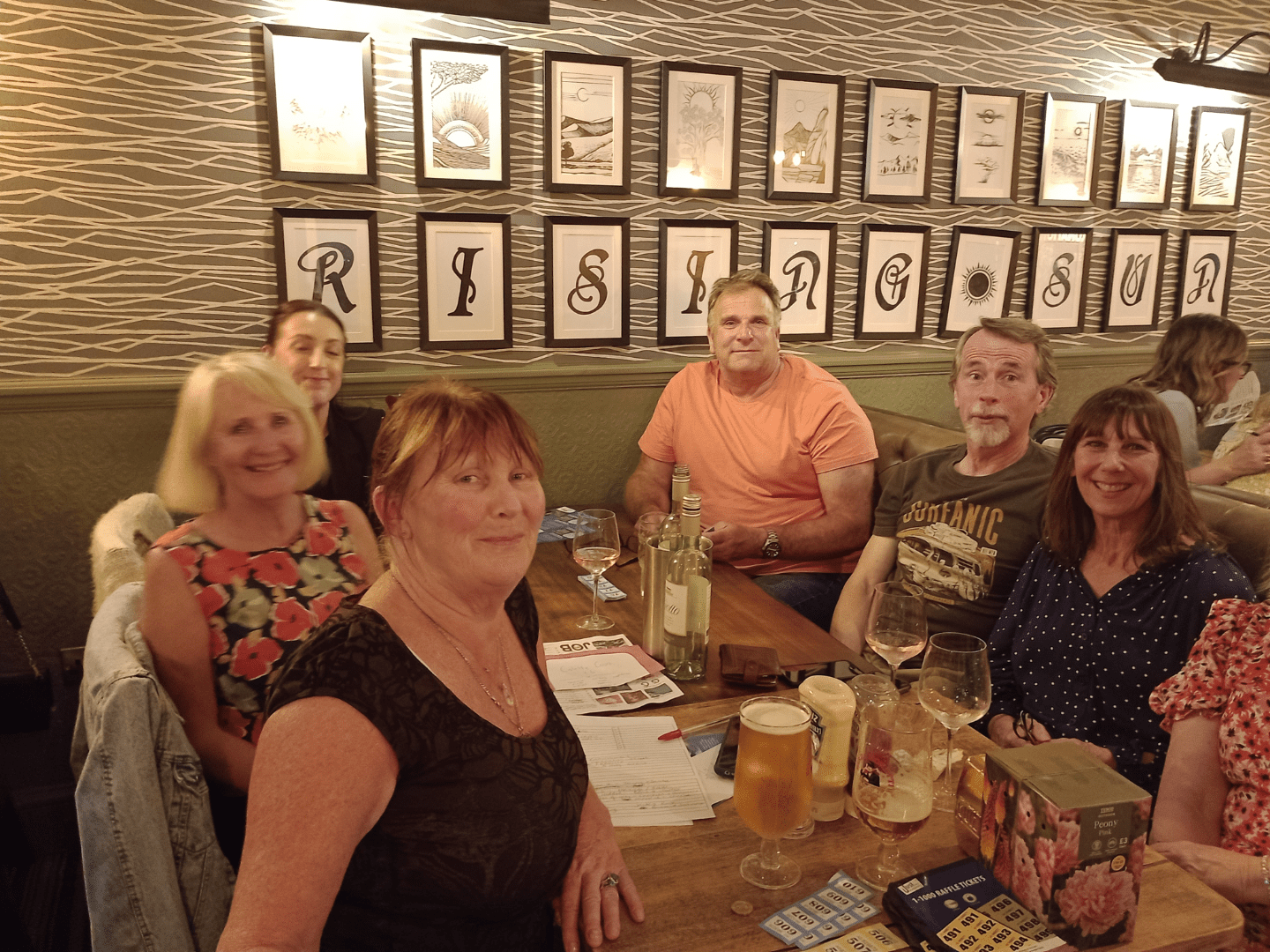 A group of people taking part in a pub quiz
