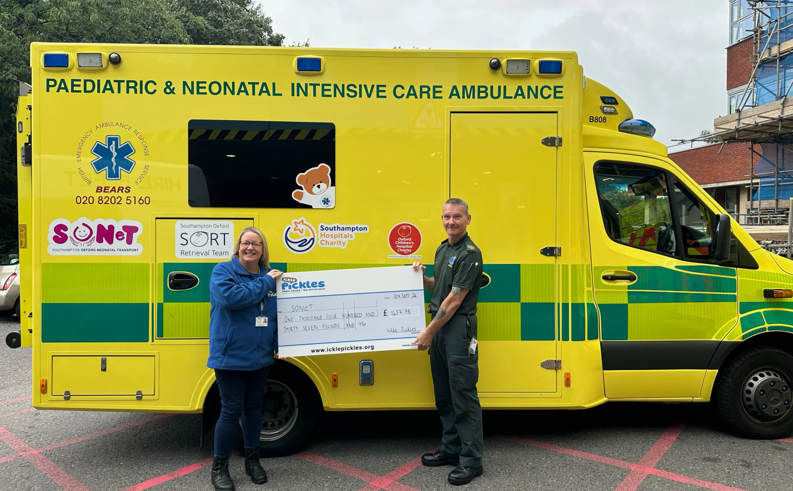 Lorraine from Ickle Pickles presenting a cheque to Southampton and Oxford's Neonatal Transport Service
